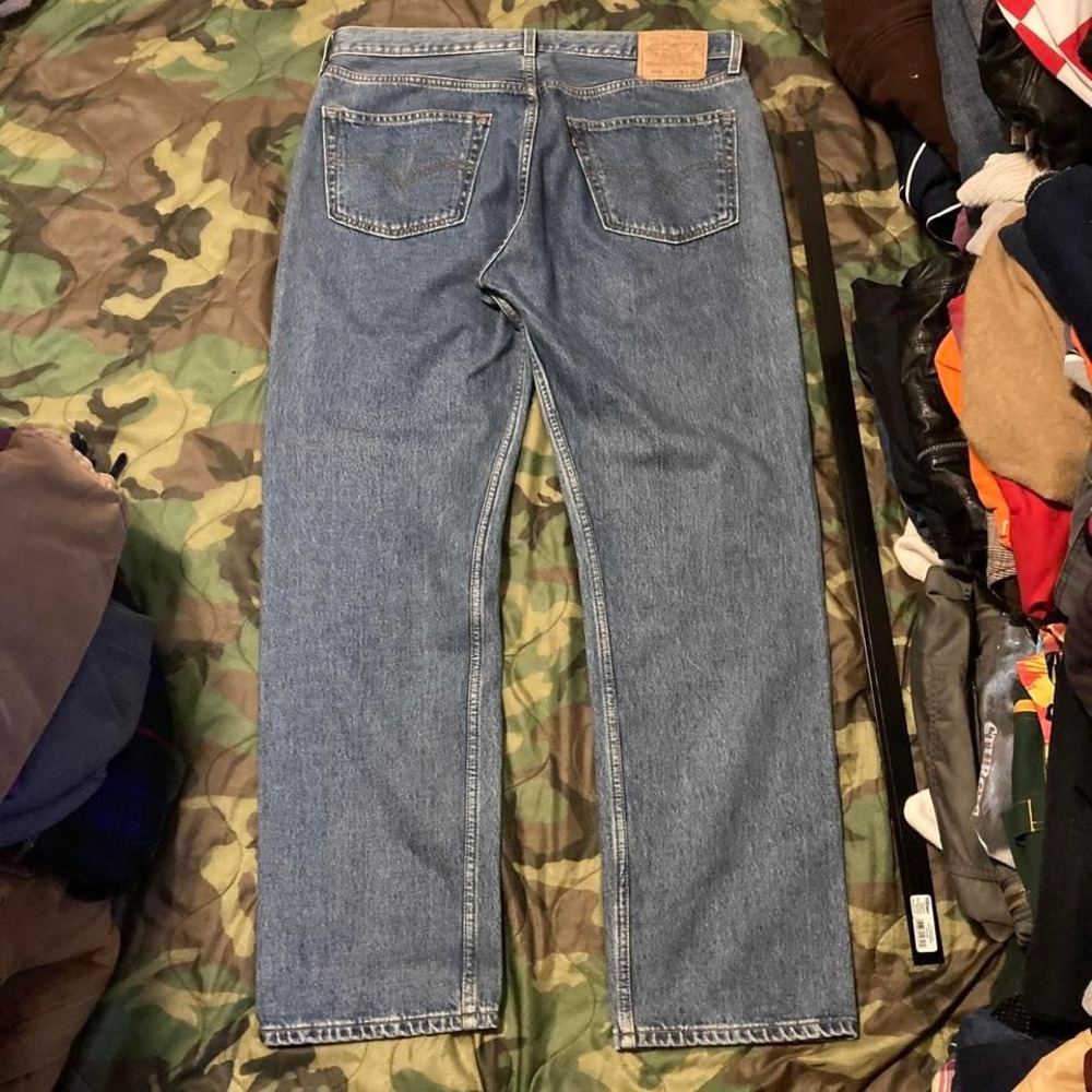Vintage 00s Levi's 501xx button fly denim paper tag‎